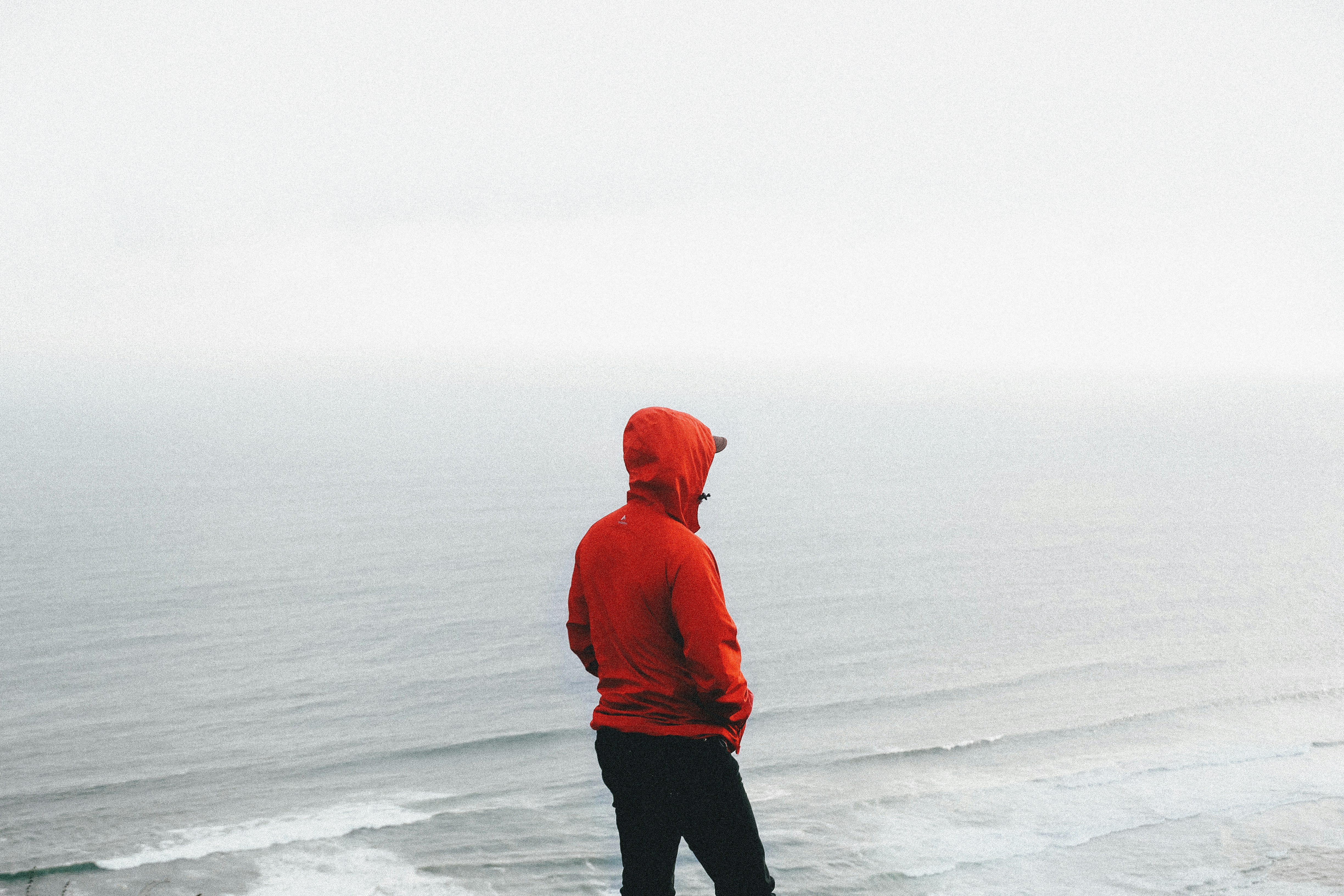 A model sporting a sleek, olive green lightweight parka