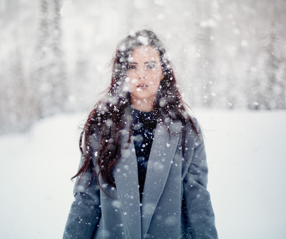 selective focus photograph of woman in gray coat