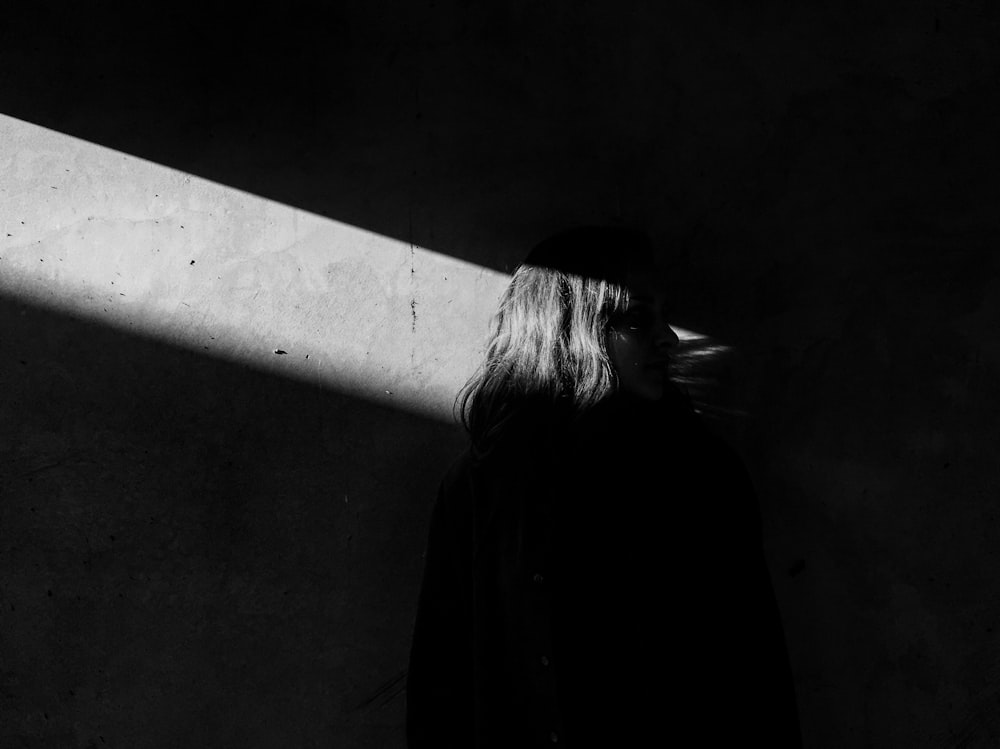 grayscale photo of woman's back