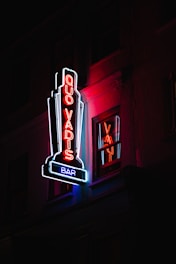 Quo Vadis bar lighted signage