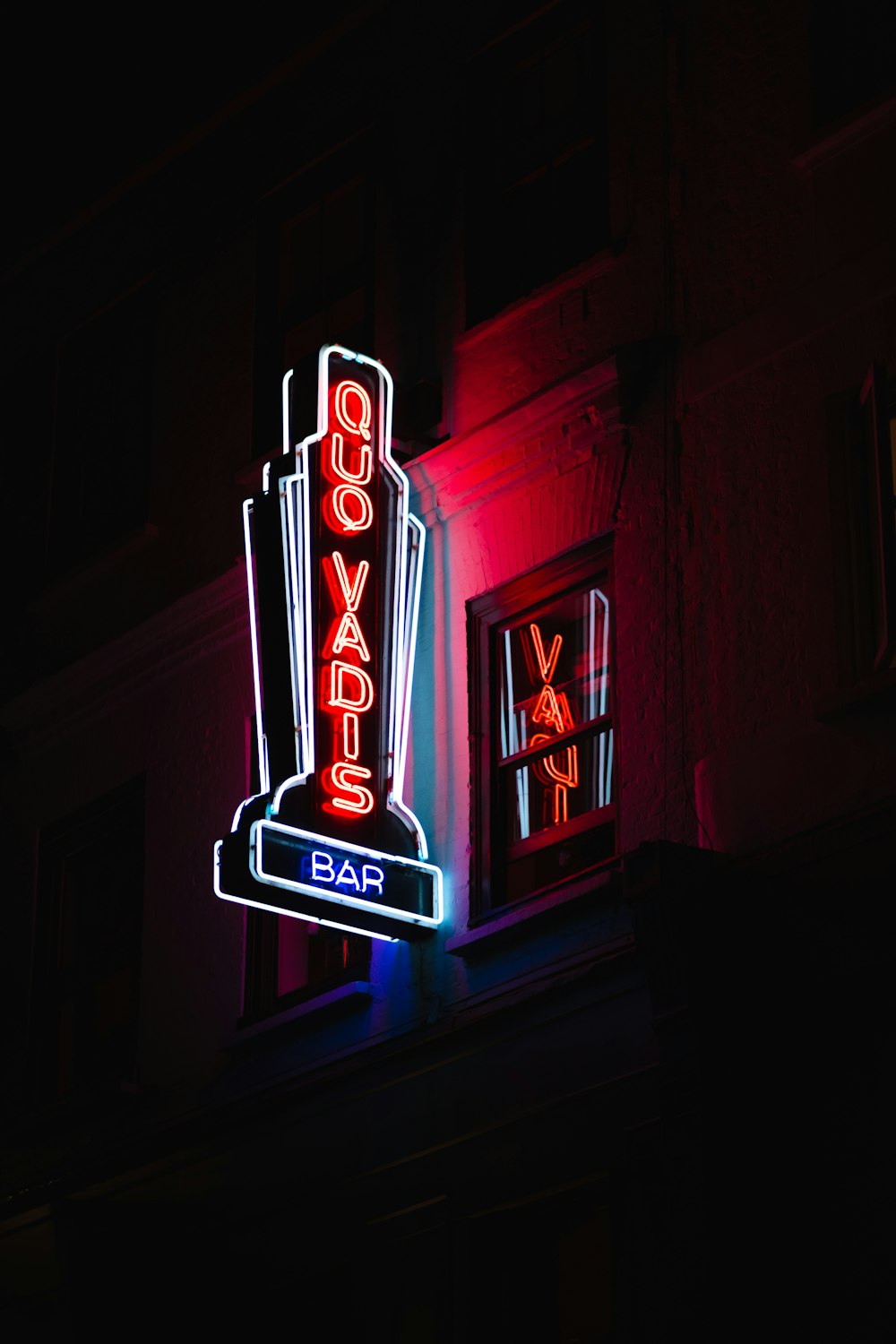 Quo Vadis bar lighted signage