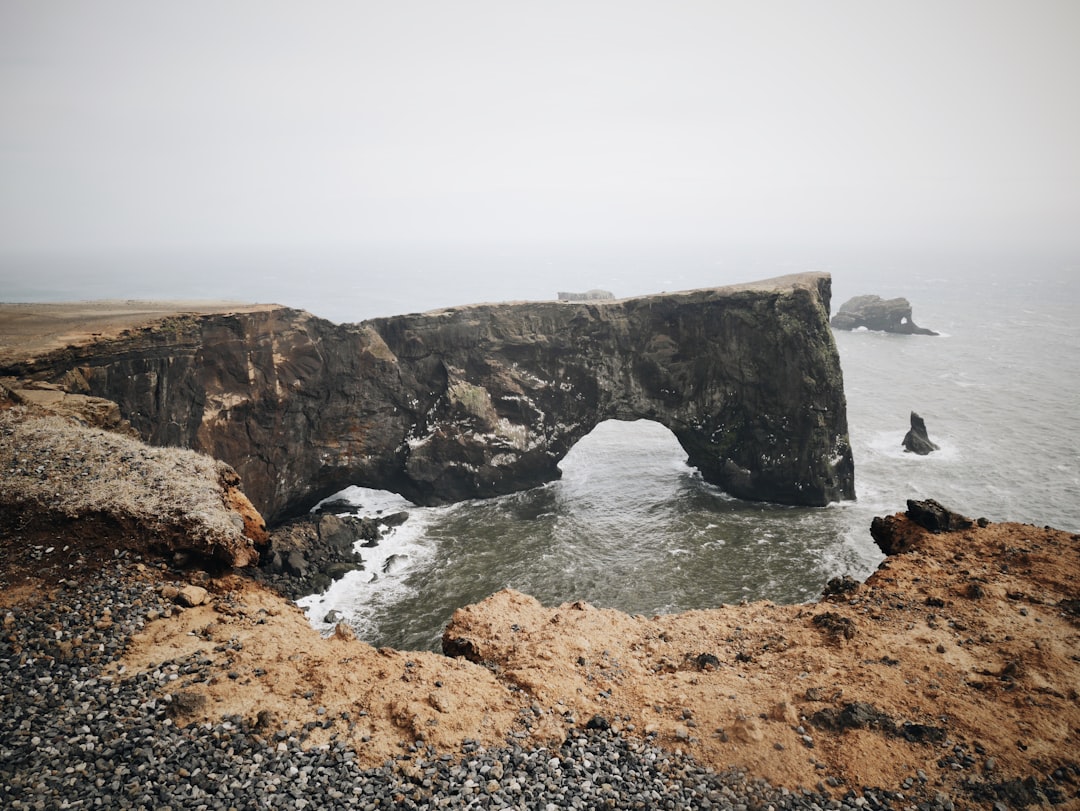 Cliff photo spot Dyrhólaey Reynisfjara Beach