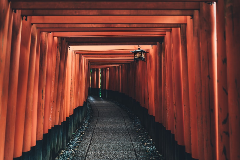 candle lantern hanged on orange tunnel