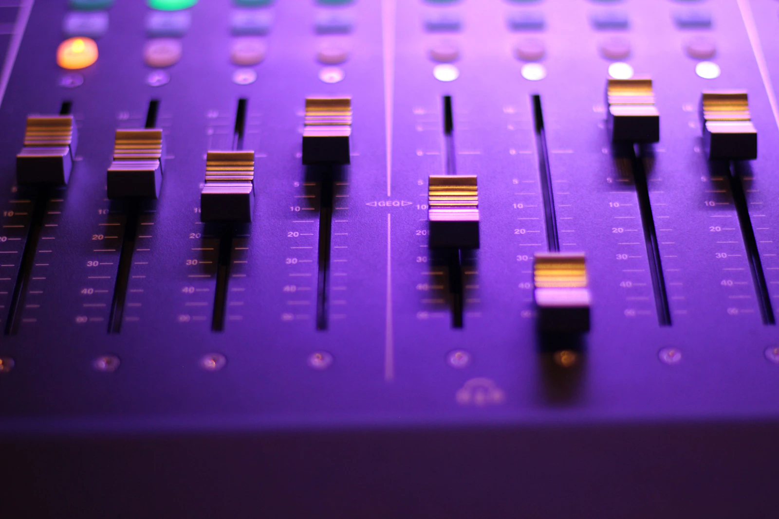 Closeup of faders on an audio mixer