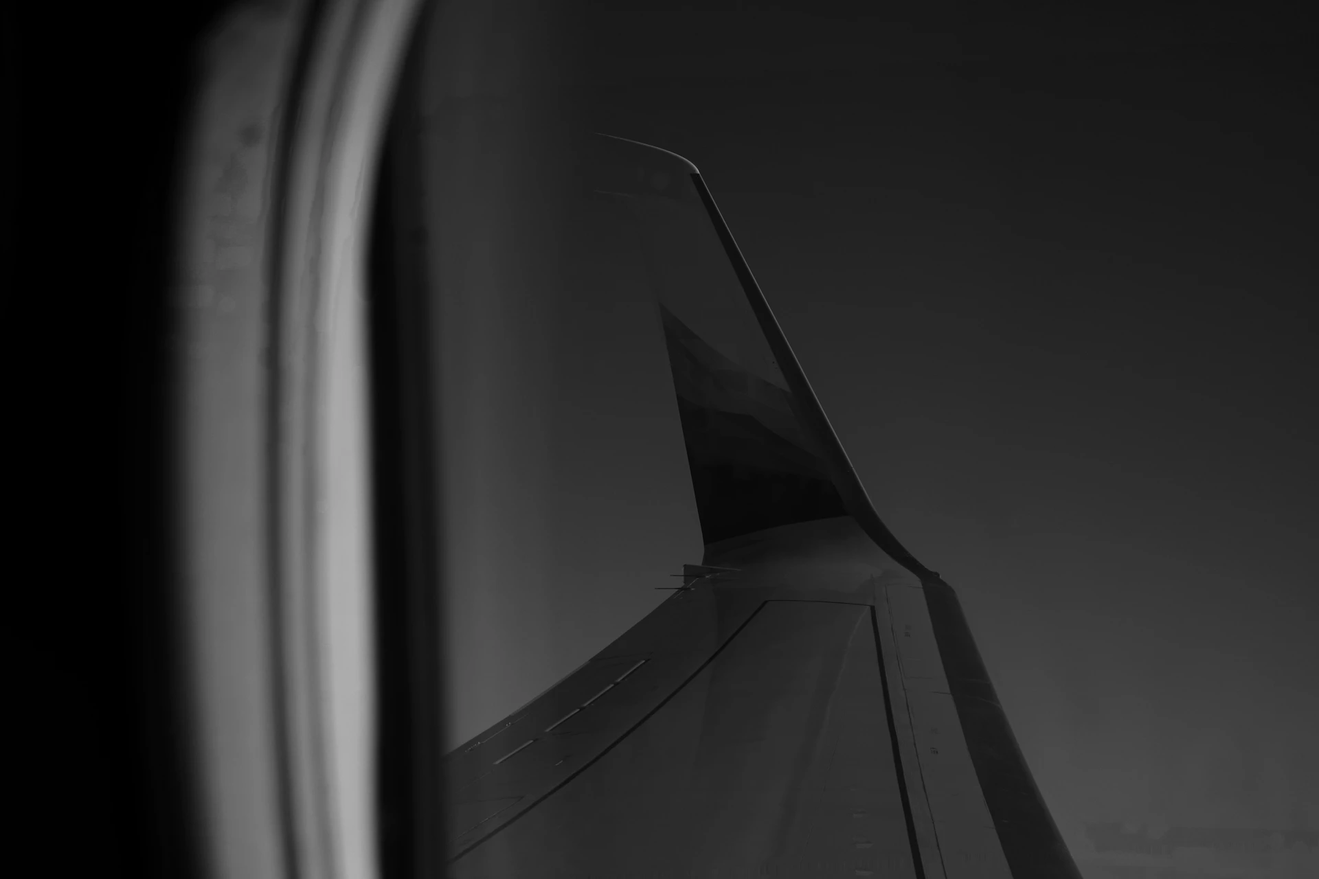 grayscale photography of plane wing