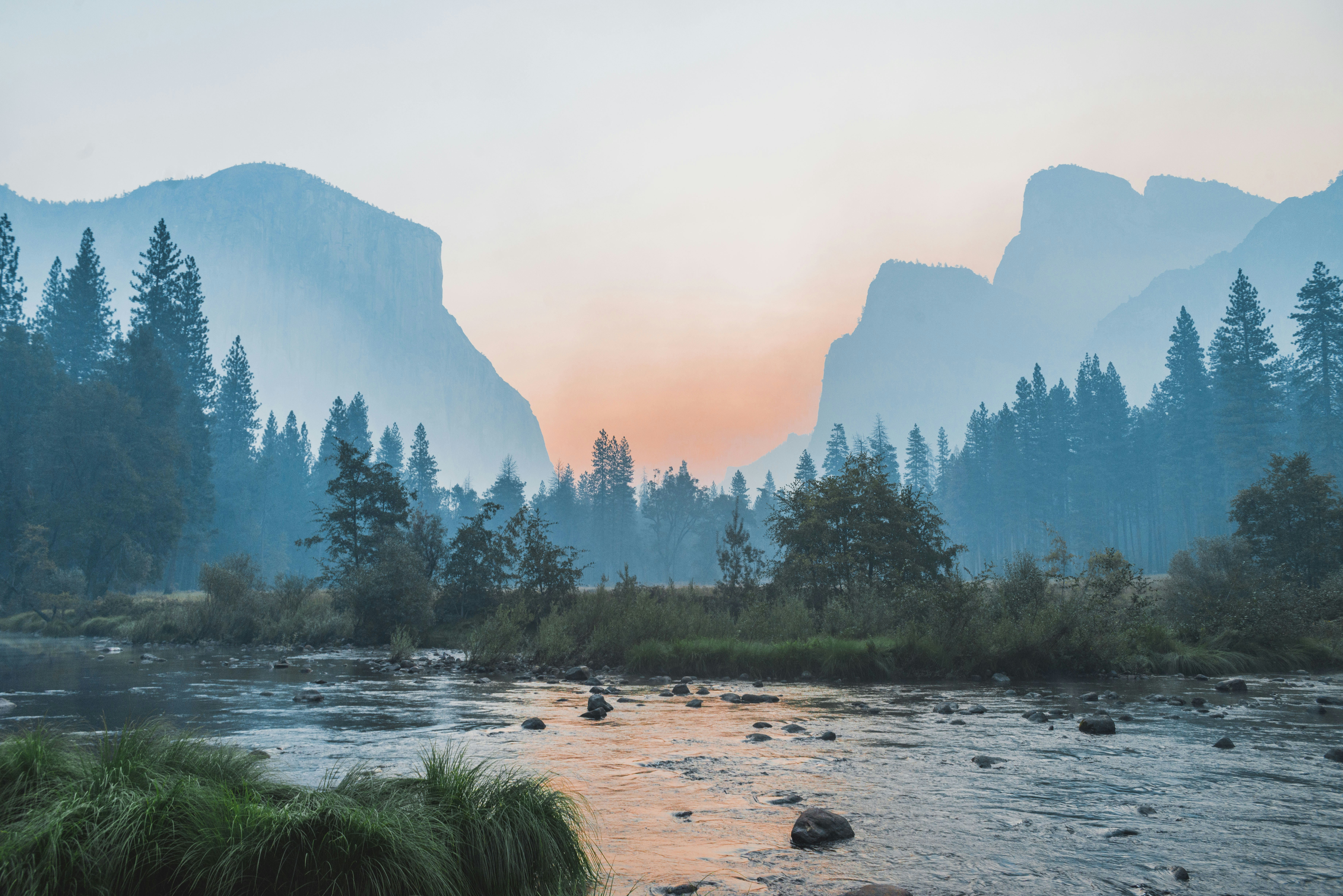 I was freezing cold staying in the tent cabins in Half Dome (formerly Curry) Village in Yosemite Valley with my dad who was there for work, so I got up and drove around the valley at 6 am. There’s been lots of fires in the area and the valley was filled with this thick smoke. Stopped at a turnout near Tunnel View and shot this photo - I really love the symmetry of it and the smooth gradients the smoke produces.