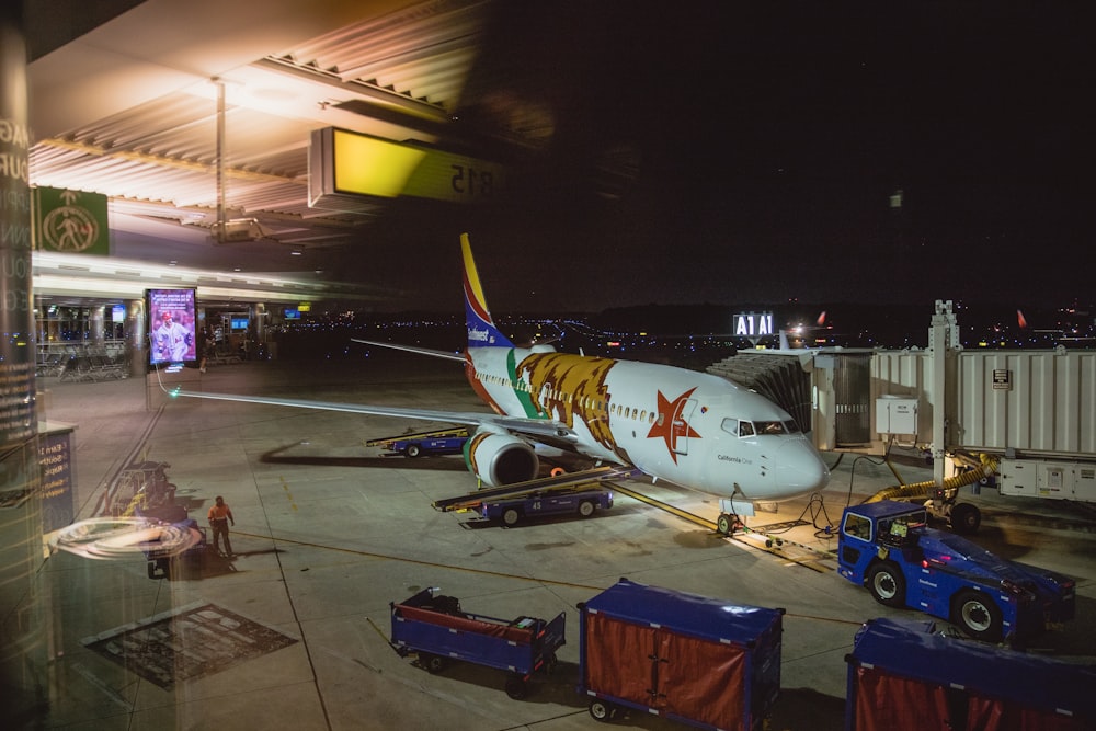 airplane near warehouse during night