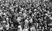 grascale photo of people standing on ground\