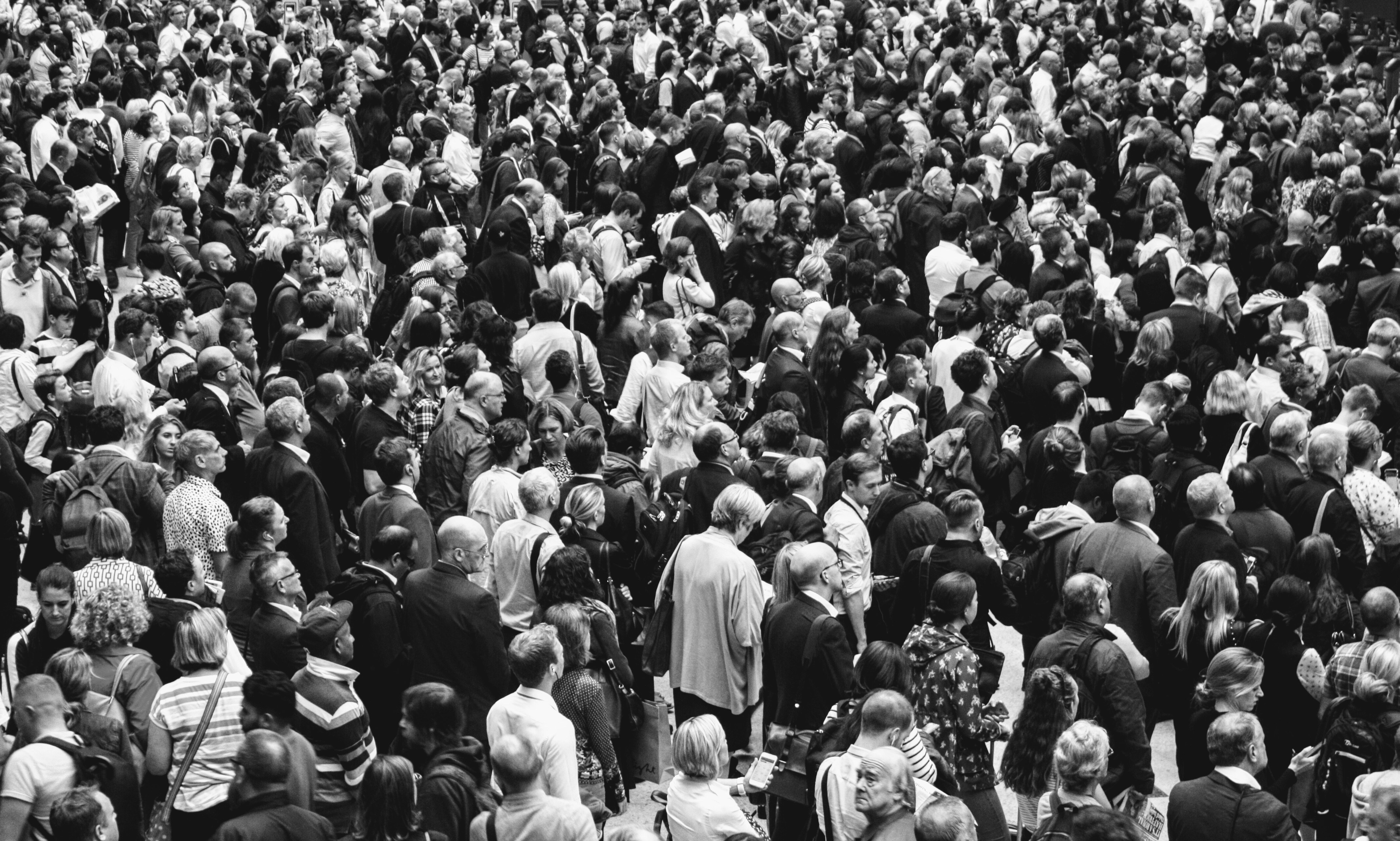 grascale photo of people standing on ground