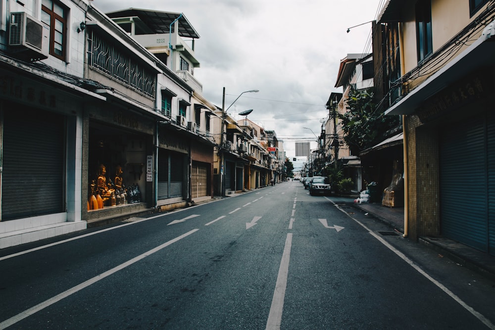 low light photography of the street under cloudy sky