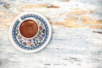 flat lay photography of cup filled with coffee