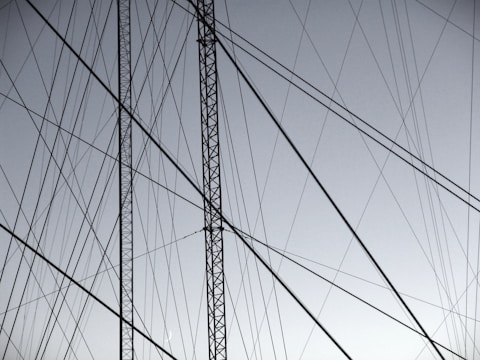 grayscale photography of gray steel structure