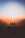 silhouette of three people up on mountain cliff