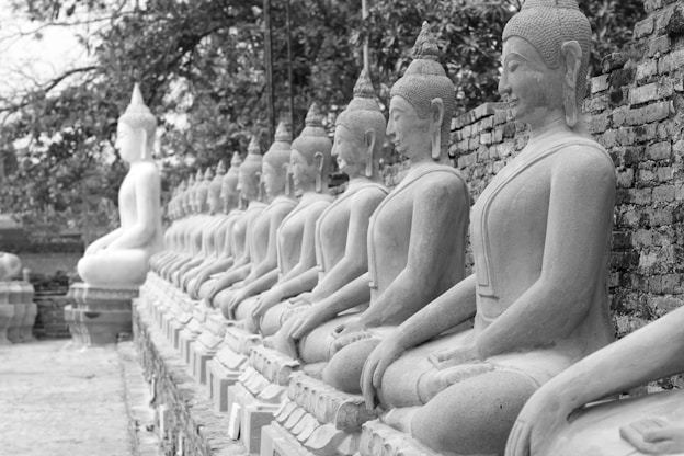 grayscale photography of concrete statue