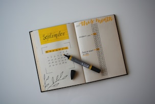 white planner with pen on top