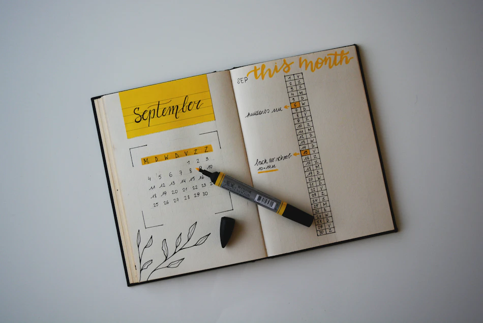 A real photograph of a journal with pen, showing flexible personal planning