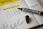 black marker on notebook