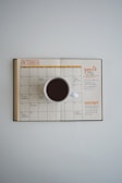 white coffee mug on calendar at october