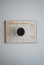 Focused entrepreneur planning growth strategies with notes and coffee