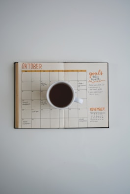 A photo of a handwritten budget planner filled with colorful notes and goals.