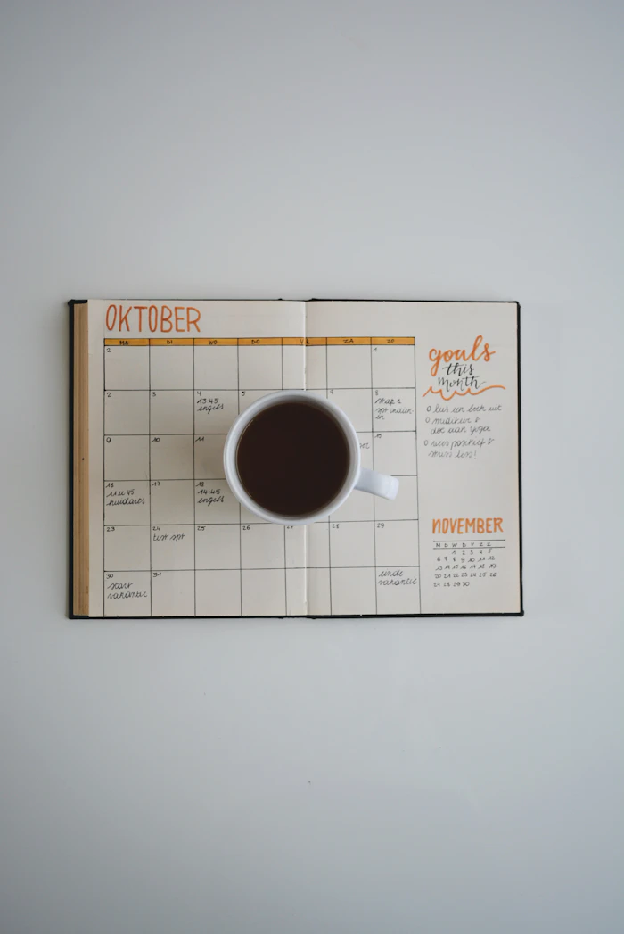 Monthly planner calendar with a cup of coffee