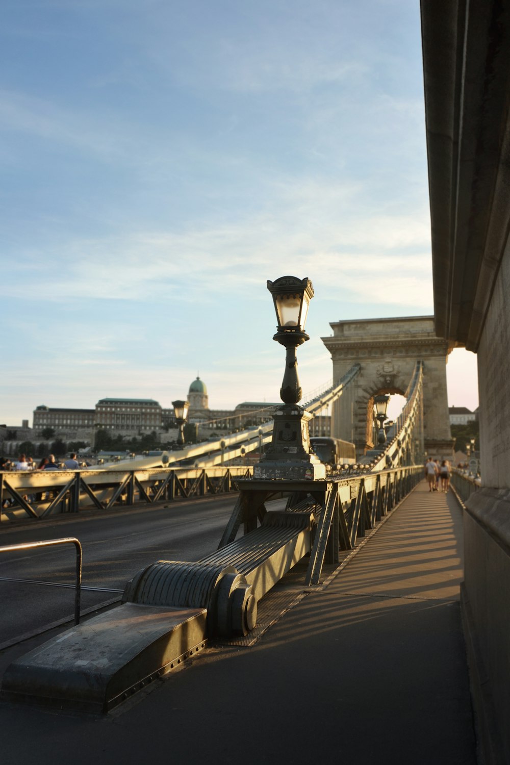 photography of people walking on gray bridge