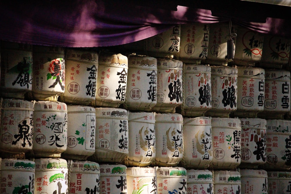 pile of beige container with kanji script printed