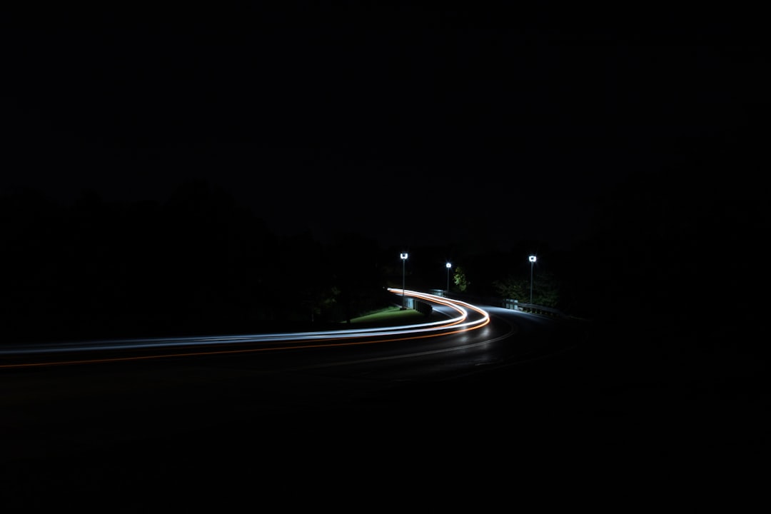 time-lapse photography of moving vehicles on road