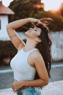 woman wearing white tank crop top