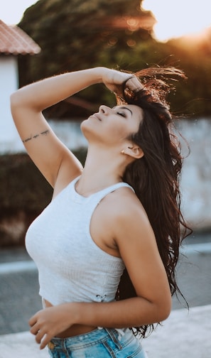 woman wearing white tank crop top