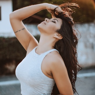 woman wearing white tank crop top