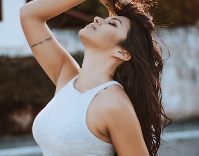 woman wearing white tank crop top