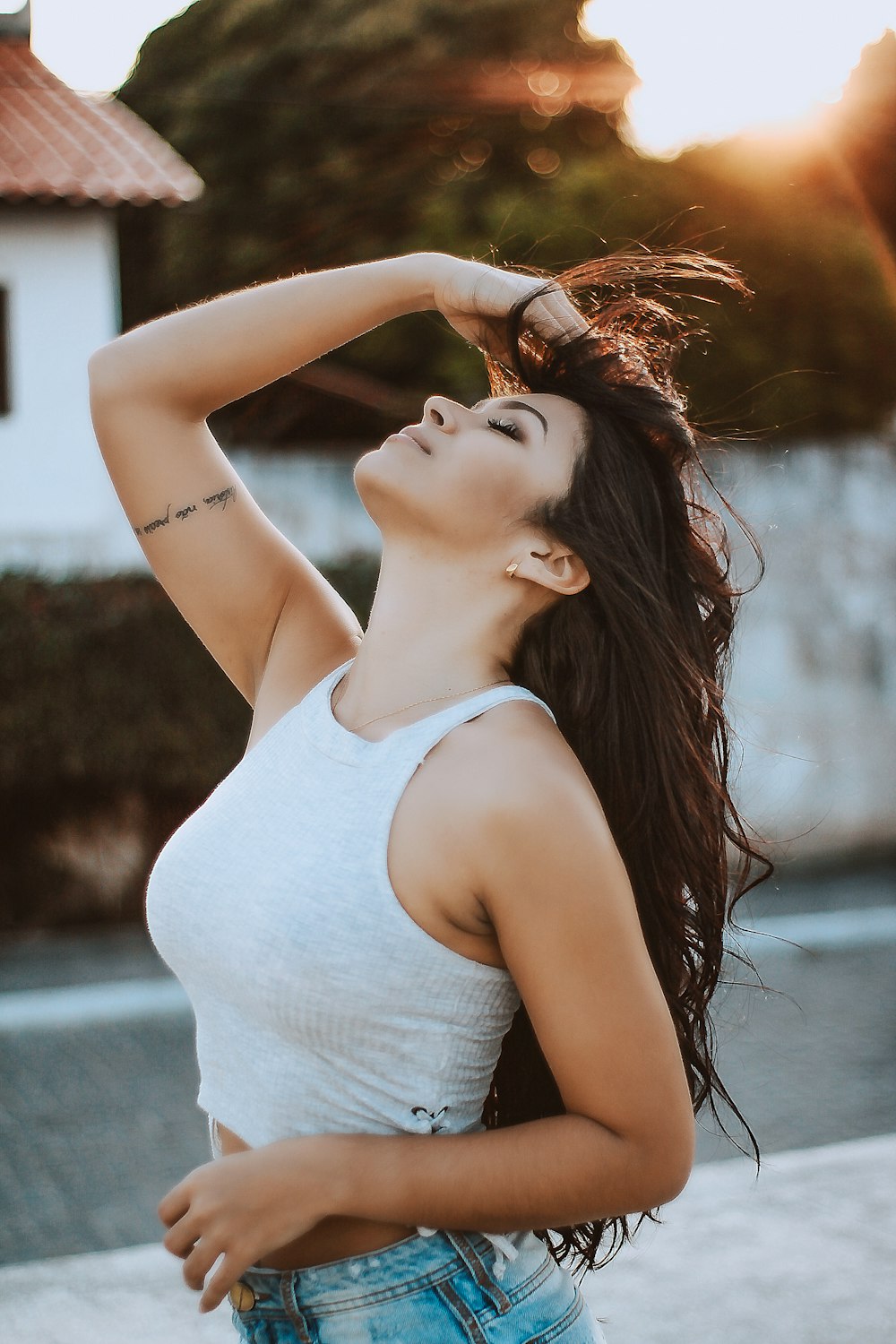 woman wearing white tank crop top