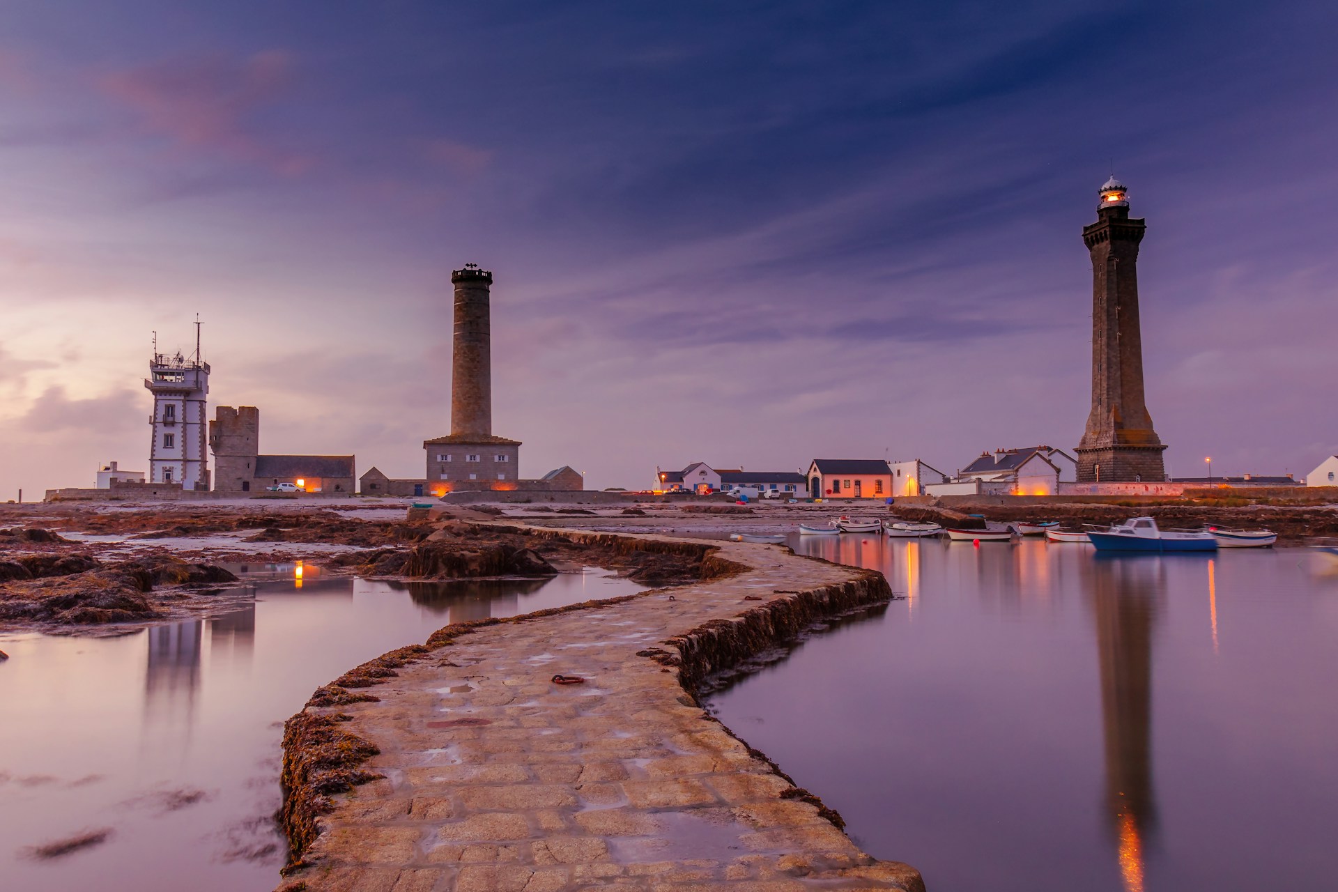lighthouse tower near body of water