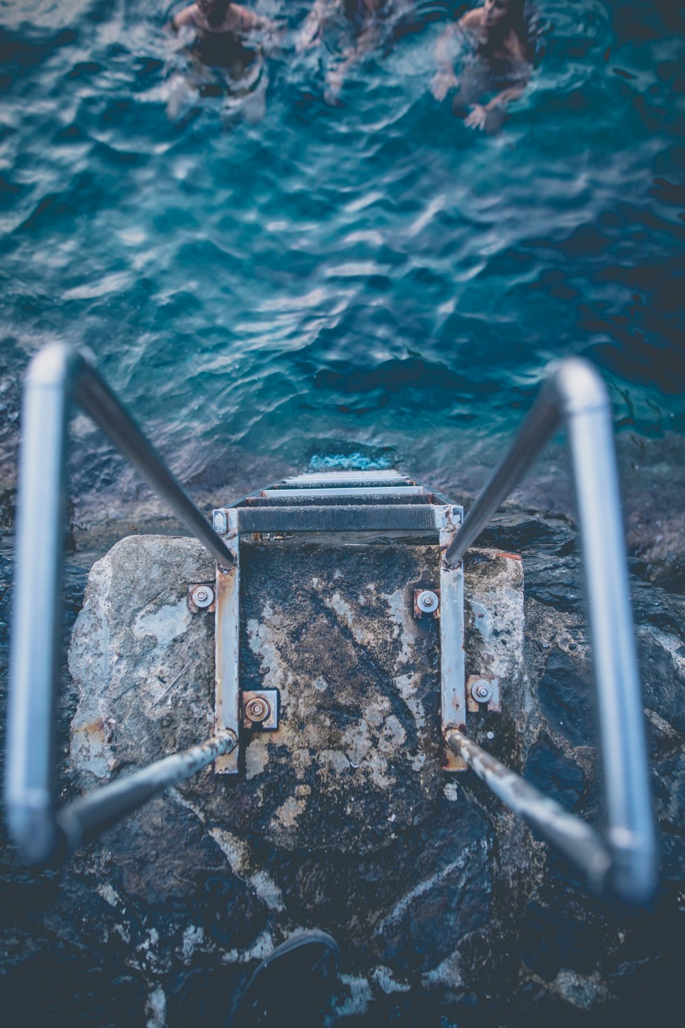 point of view photography of gray metal ladder