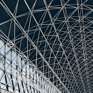 worm's-eye view of steel frame of indoor structure