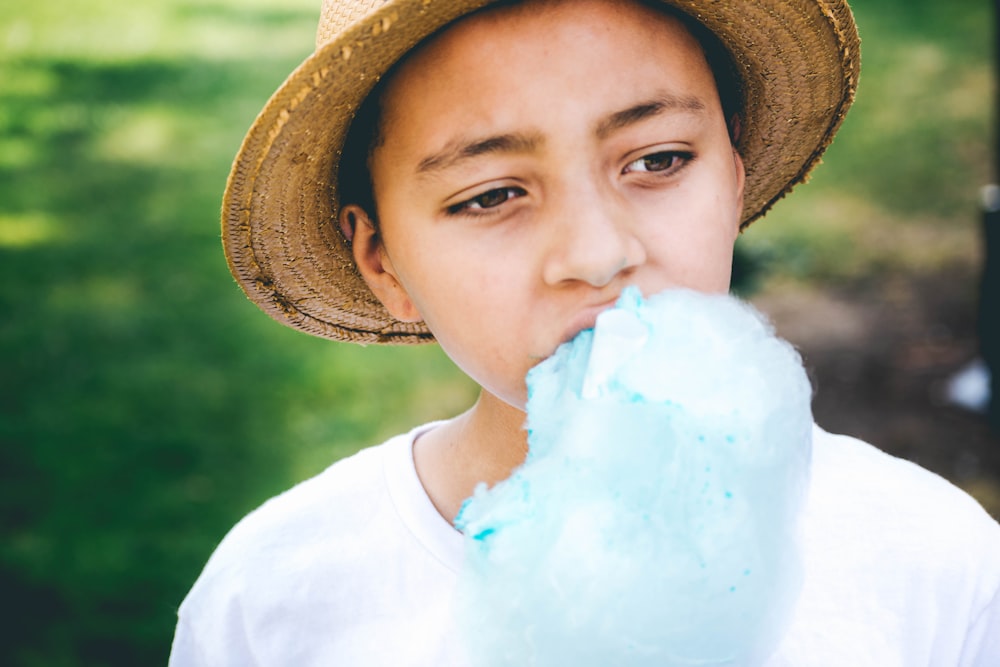 person eating blue cotton candy