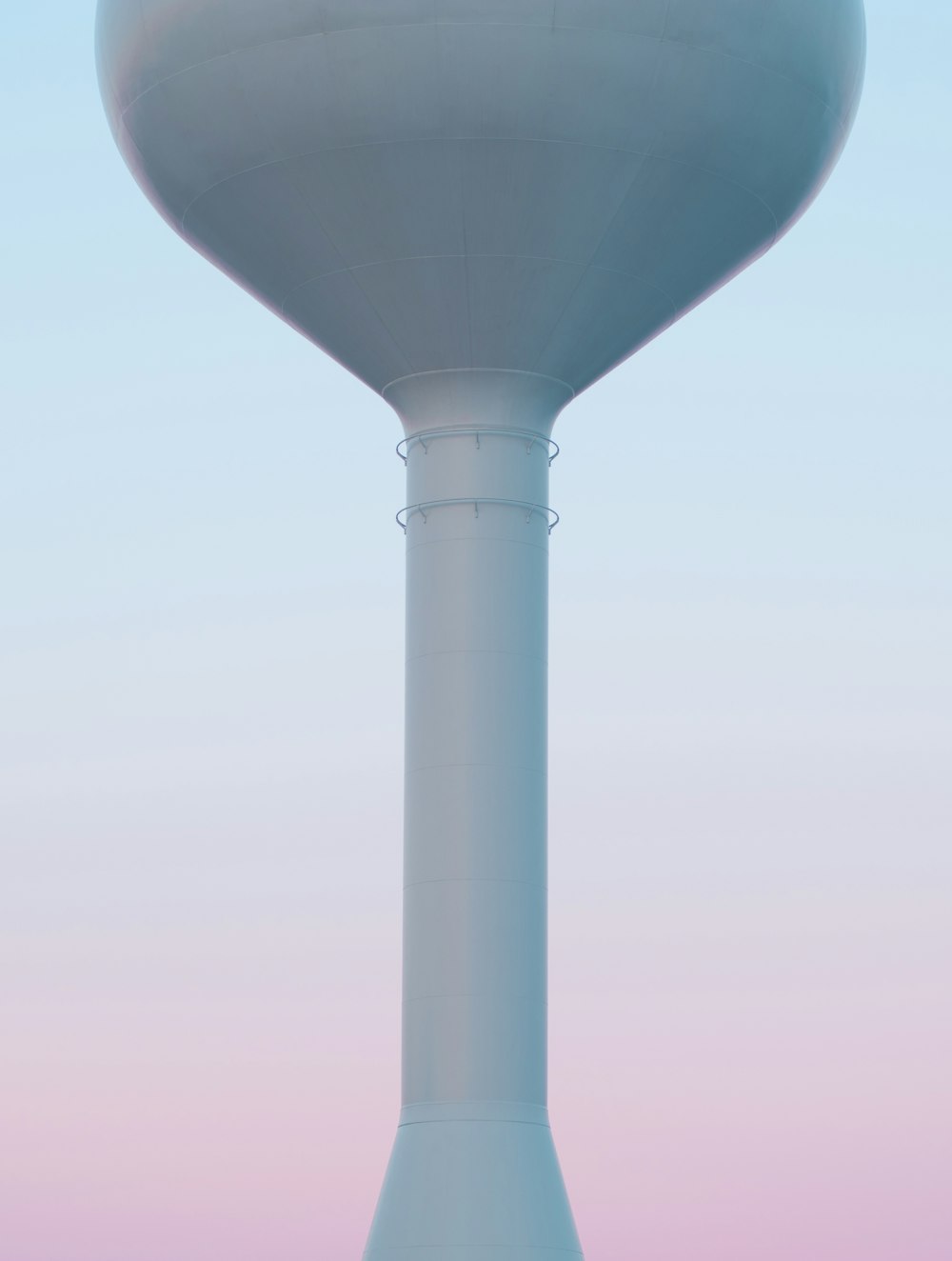 gray concrete silo under cloudy sky