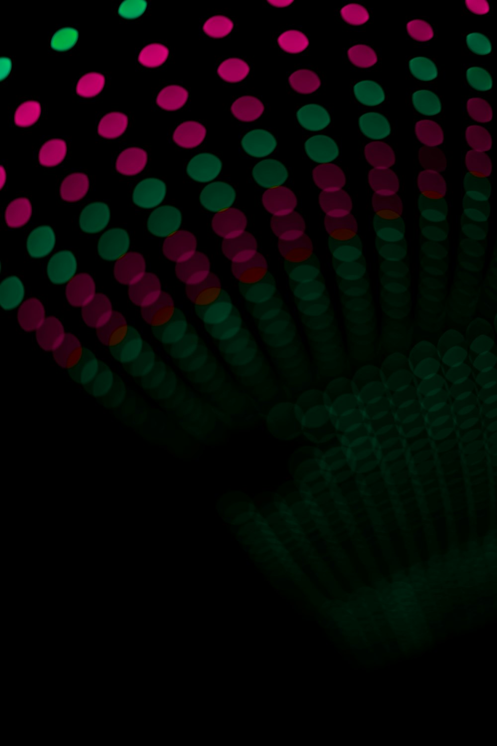 a close up of a fan on a black background