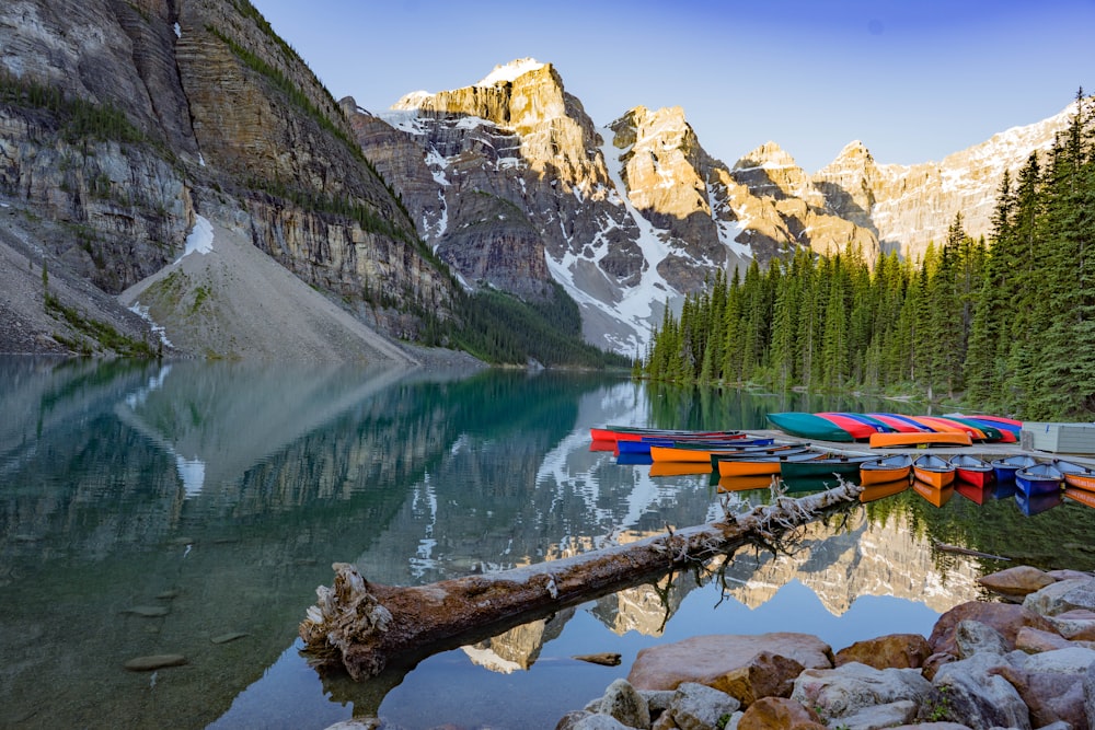 Mount Moraine lake with assorted-color canoes in nature photography