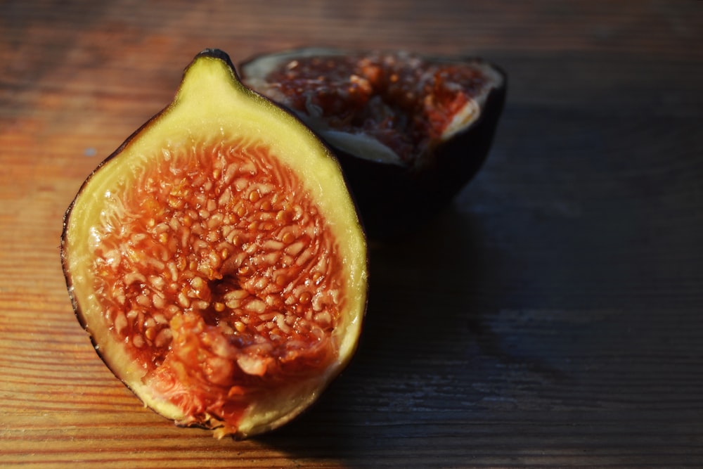 fig on brown wooden surface