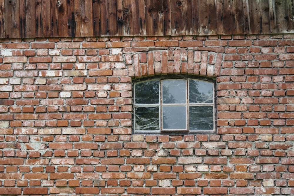 closed brown wooden framed glass window