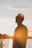 man standing near body of water