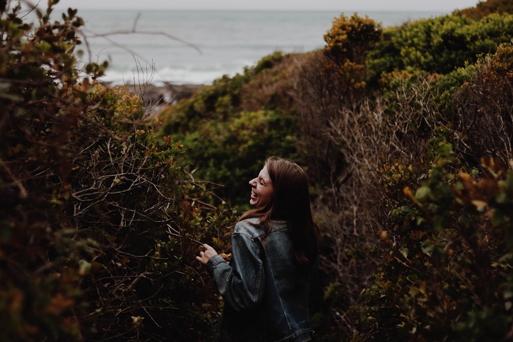 woman standing near plants during daytime