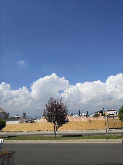 A simple construction site with a clear blue sky background.