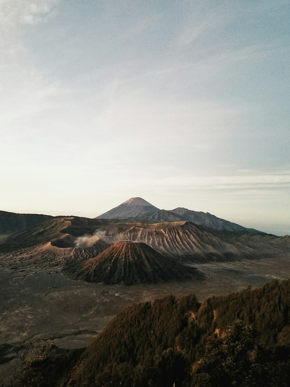 photo of crater and mountain