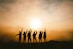 silhouette photo of six persons on top of mountain