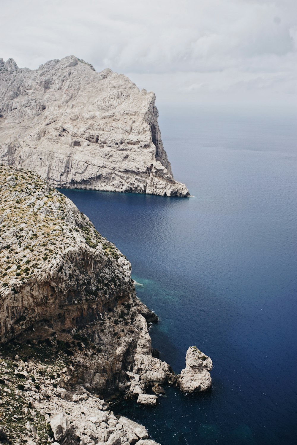 photo of grey rocks surrounded on sea water