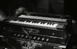 A close-up of a tabla and harmonium set up ready for a performance.