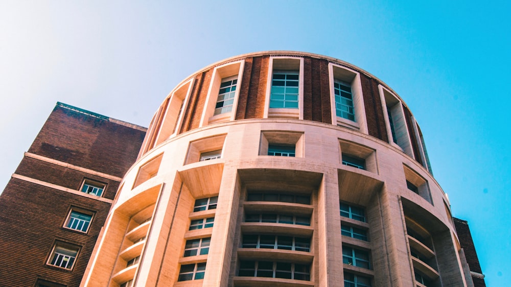 low angle photography of beige building